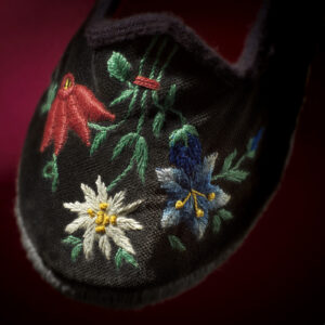 Detail of floral embroidery on velvet upper, women's ‘Scarpets’, from Villa Santina - Carnia, kept at the Museo Carnico, photo Massimo Gardone / Azimut.